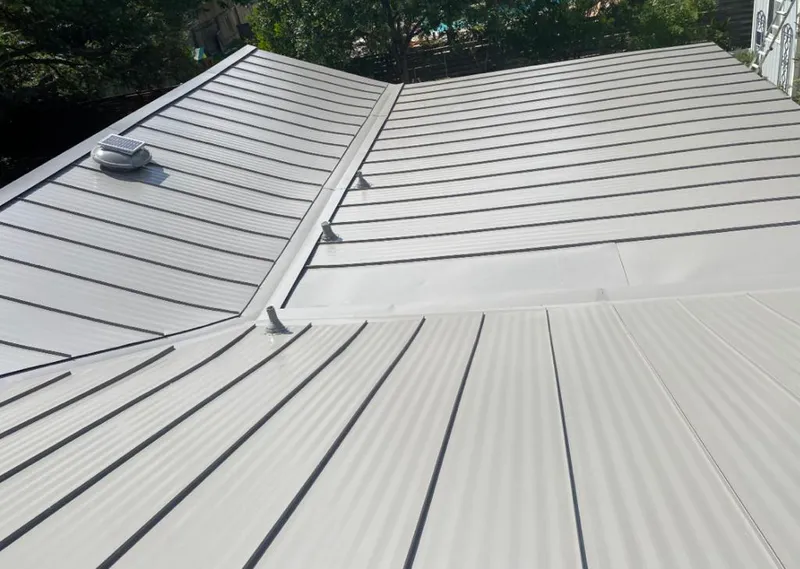 Solar attic fan installed on a metal roof for Roof Ventilation in Lighthouse Point